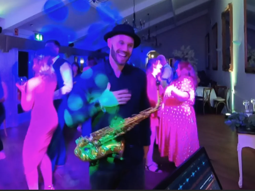 Spencer Sax with a wedding DJ